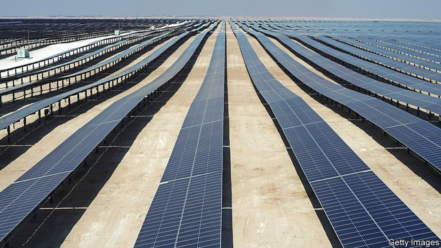 This picture taken on October 18, 2022 shows a view of solar panels at the newly-inaugurated al-Kharsaah solar power plant in Qatar. - Gas-rich Qatar inaugurated its first solar plant on October 18, which organisers of the World Cup have said will provide clean energy for its stadiums. The solar farm in al-Kharsaah, west of the capital, is