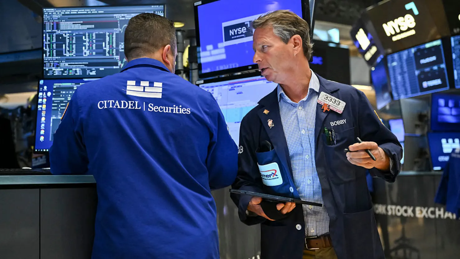 Traders work on the floor of the New York Stock Exchange (NYSE) at the opening bell on June 2, 2025, in New York City. Oil prices surged Monday over renewed concerns about Russia's war in Ukraine and relief over OPEC+ production, while stock markets mostly slumped as US-China trade tensions resurfaced. The dollar was under pressure while Wall Street opened mixed, with the Dow and the broad-based S&P 500 in the red while the tech-heavy Nasdaq rose. (Photo by ANGELA WEISS / AFP) (Photo by ANGELA WEISS/AFP via